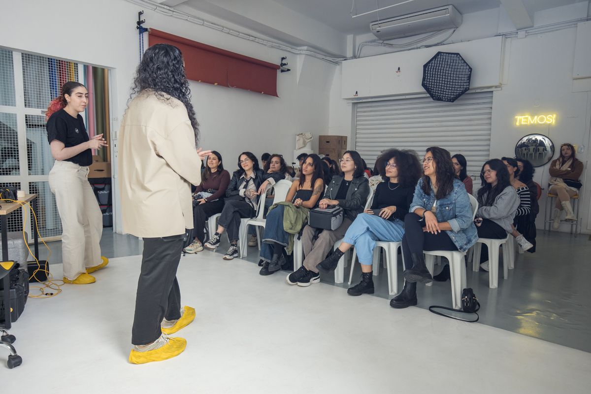 A group of adults listening during a community workshop.